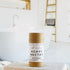 agave nectar deodorant is shown, the label is minimalist in design, white with black lettering. in the background is a spa like bathroom