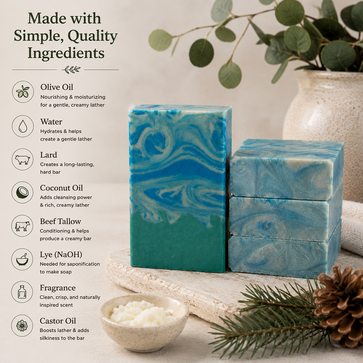 Two handmade soap bars with blue and teal marbled patterns are displayed on a rustic wooden board, surrounded by decorative props including a ceramic vase with eucalyptus, a pinecone, and a small bowl of wax. On the left, a text overlay lists the ingredients: olive oil, water, lard, coconut oil, beef tallow, lye, fragrance, and castor oil.