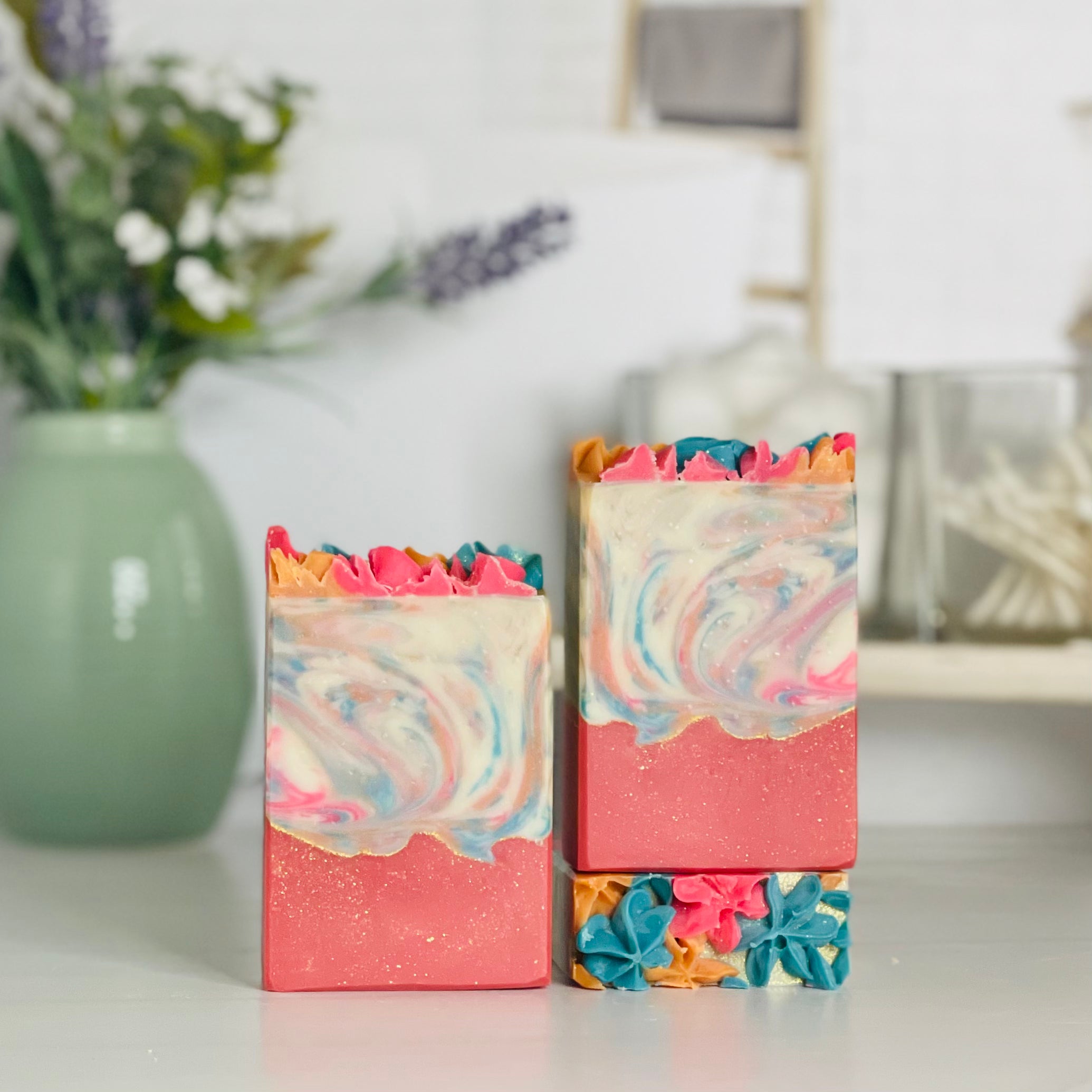 one day dreams soap is standing next to one laying flat to show the top and another standing on the flat one to show more of the soap colors