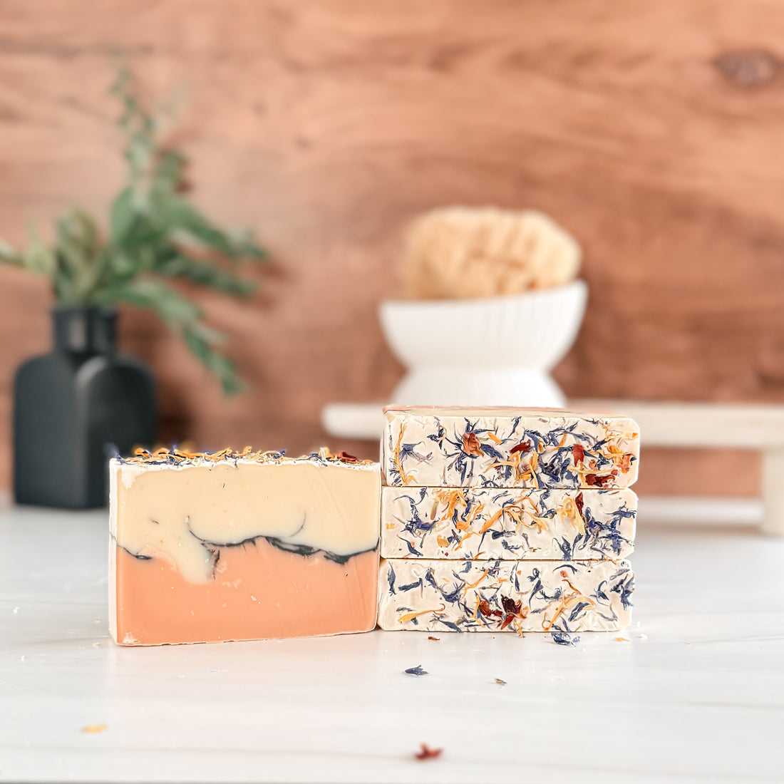 soaps stacked with botanicals on top