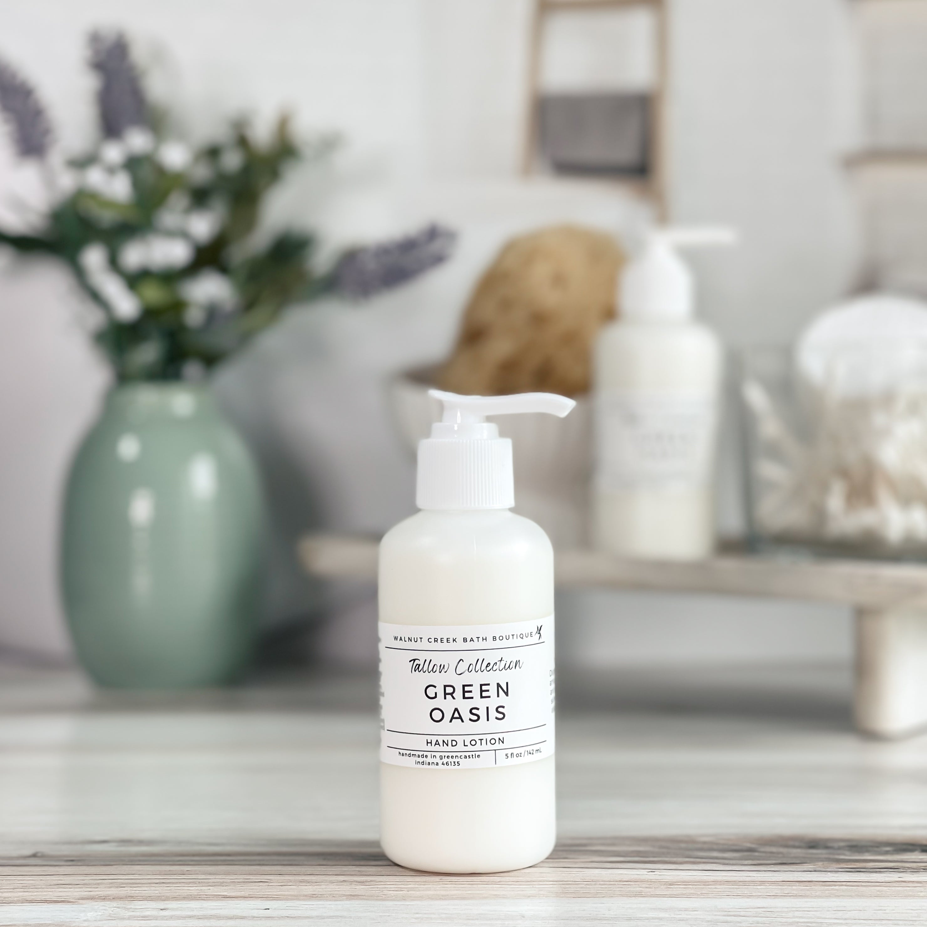 green oasis tallow lotion in a frosted white bottle with a white pump top