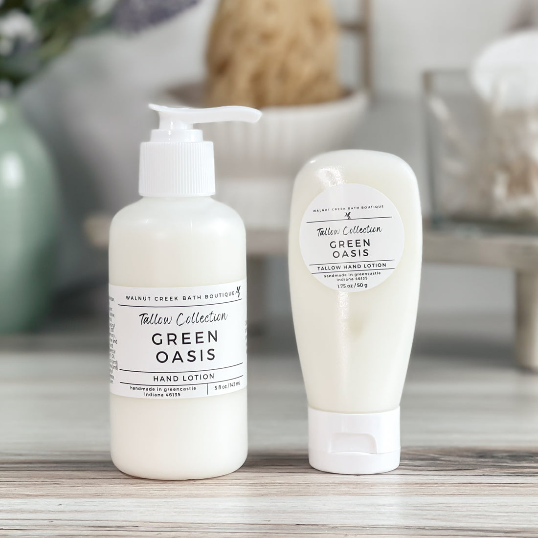 two bottles of green oasis tallow lotions, one is a smaller travel size