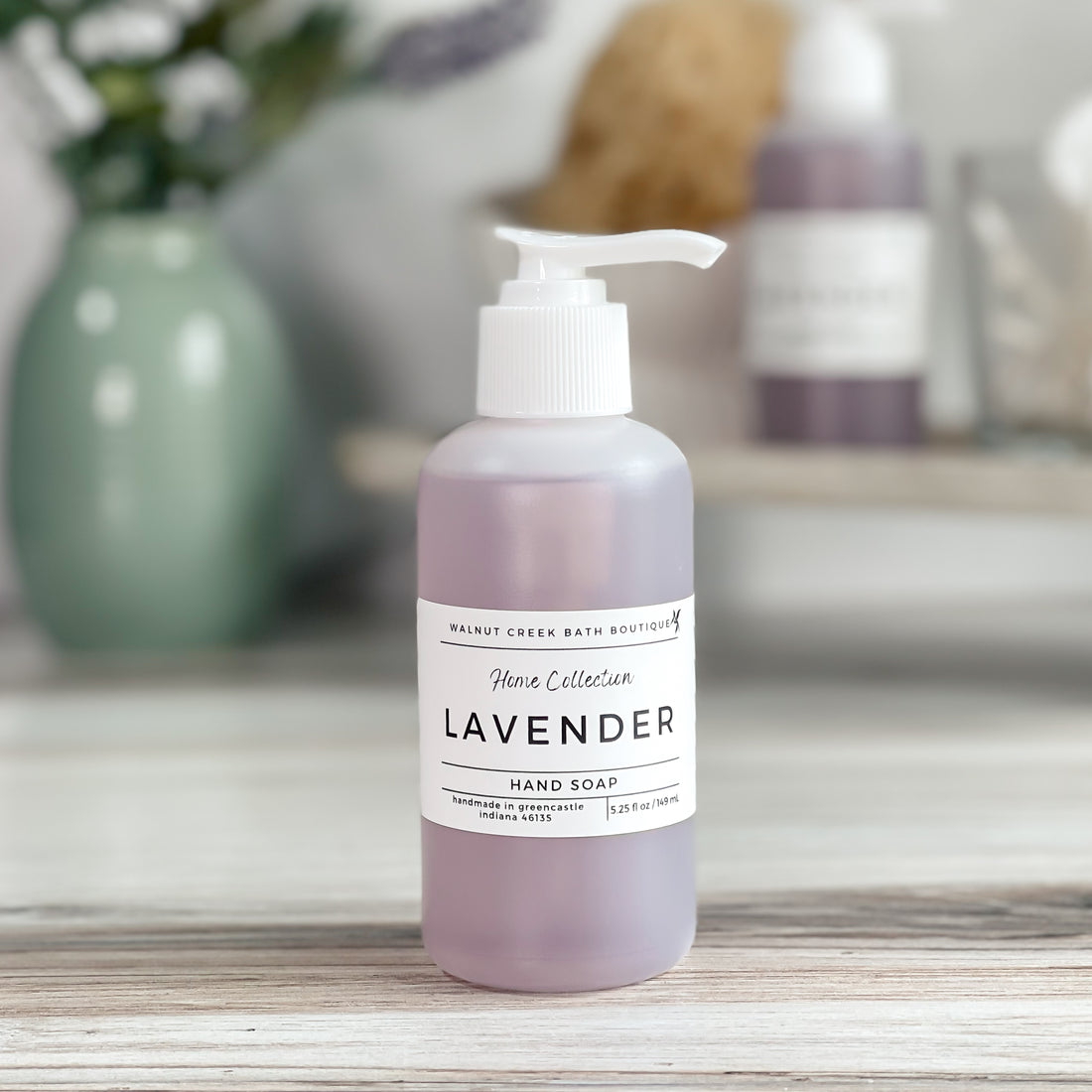 lavender liquid hand soap shown in an opaque bottle with white pump