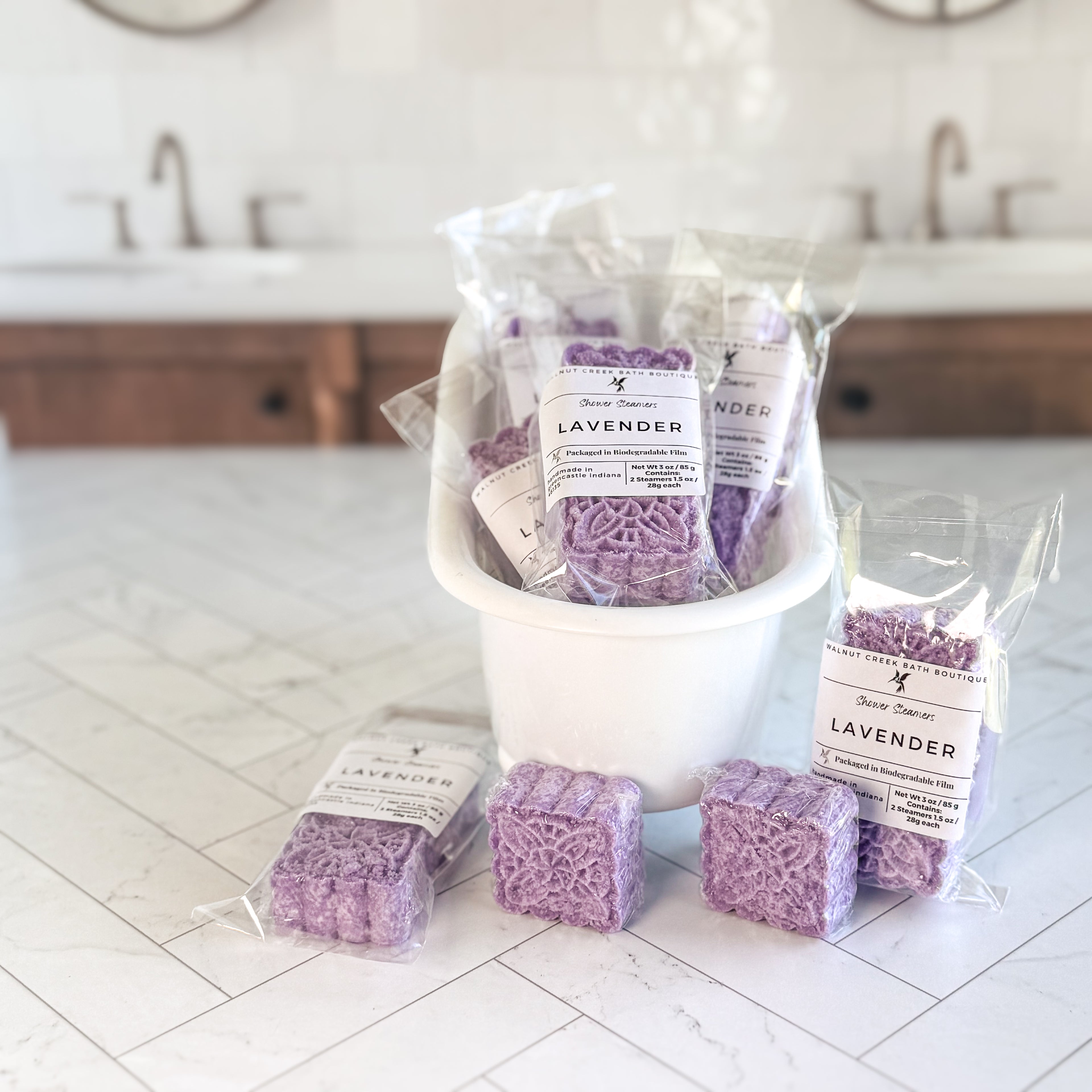 Lavender products including bars and packaging on a white tiled floor.