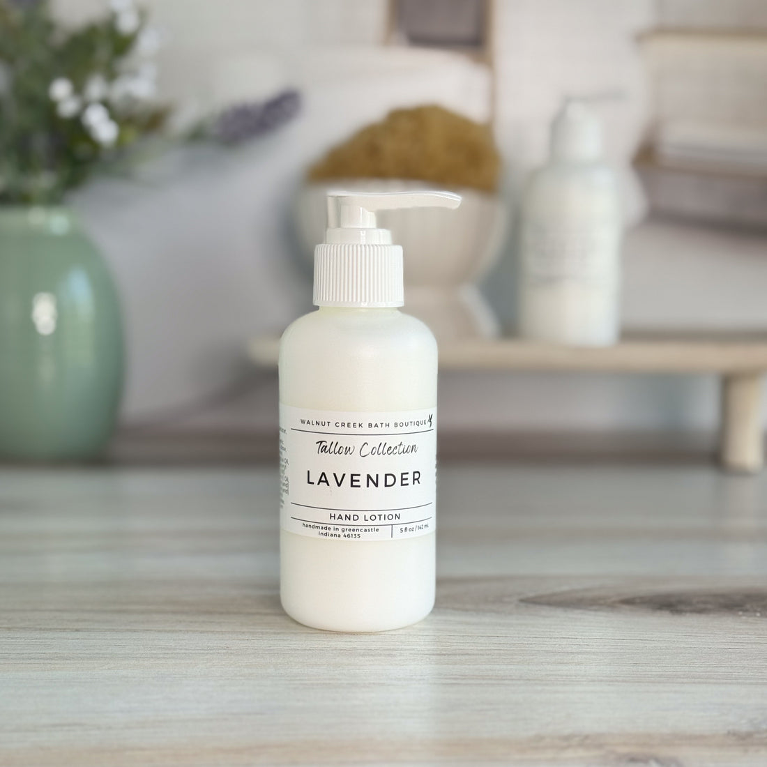 white bottle of lotion on a driftwood colored base