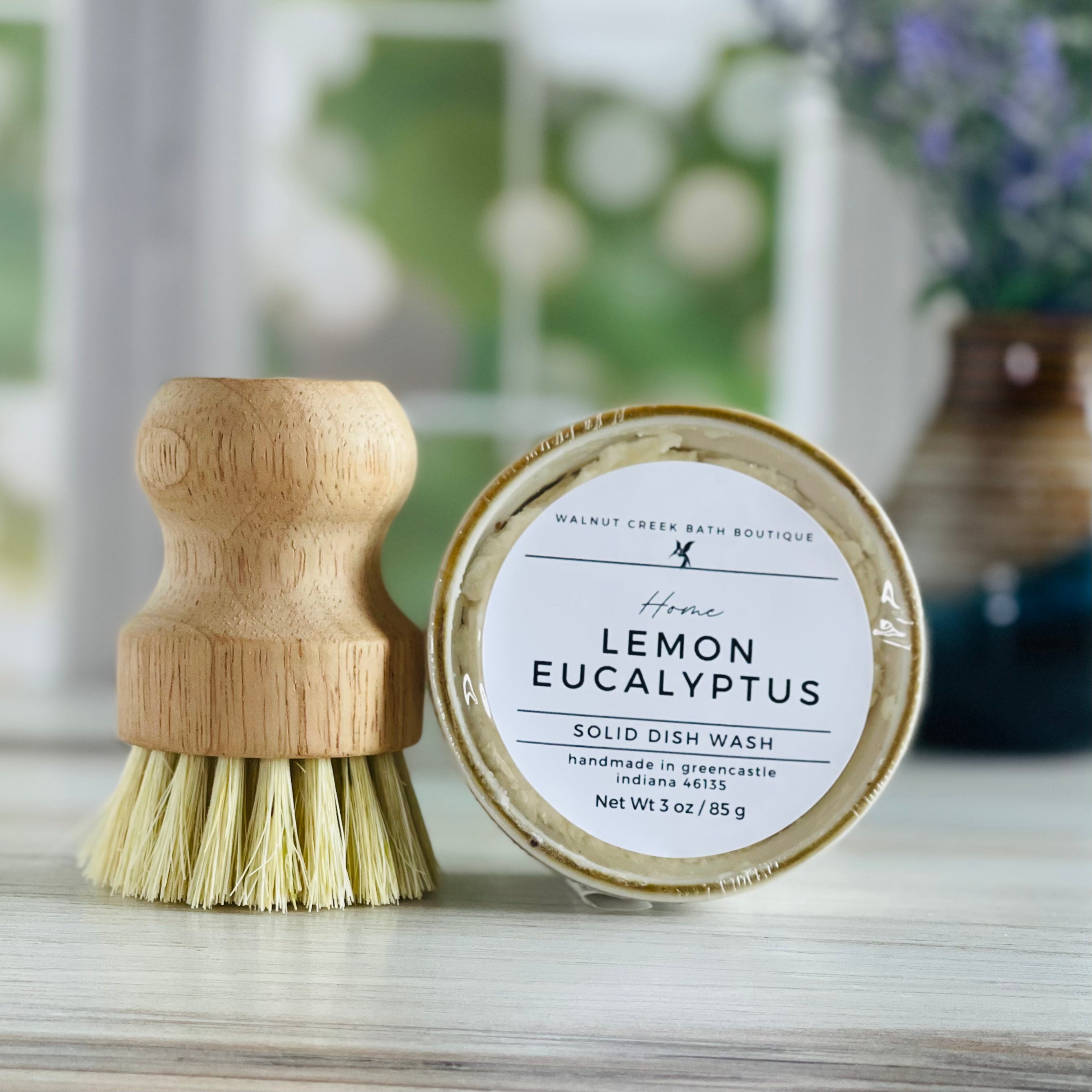 close up of lemon eucalyptus dish wash with brush