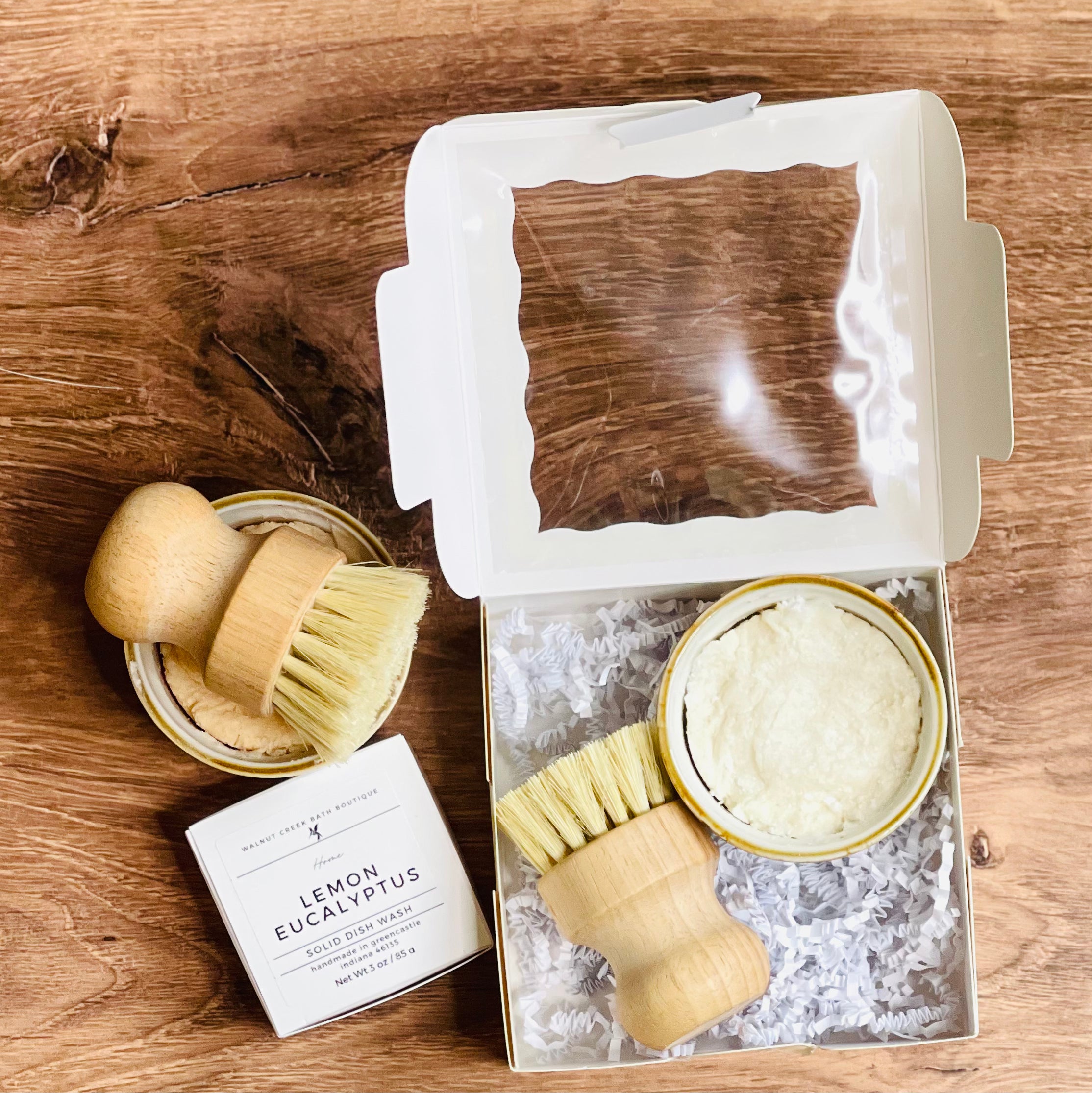our lemon eucalyptus dish was is packaged in a box that holds both the crock and the brush. a little shred keeps everything in place while also adding a touch of fun.