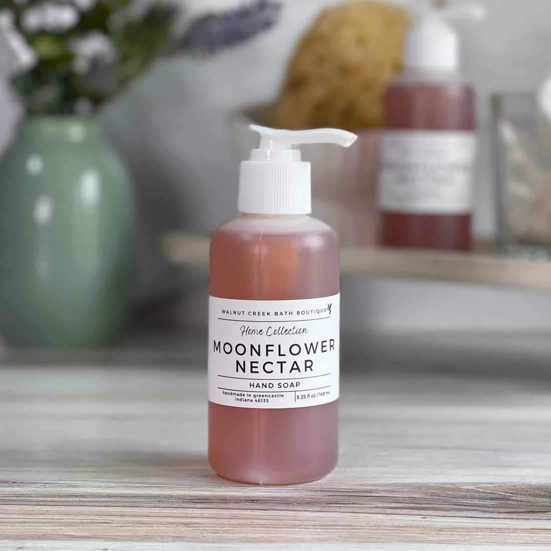 moonflower nectar hand soap in an opaque bottle but still able to see the pretty pink color through it