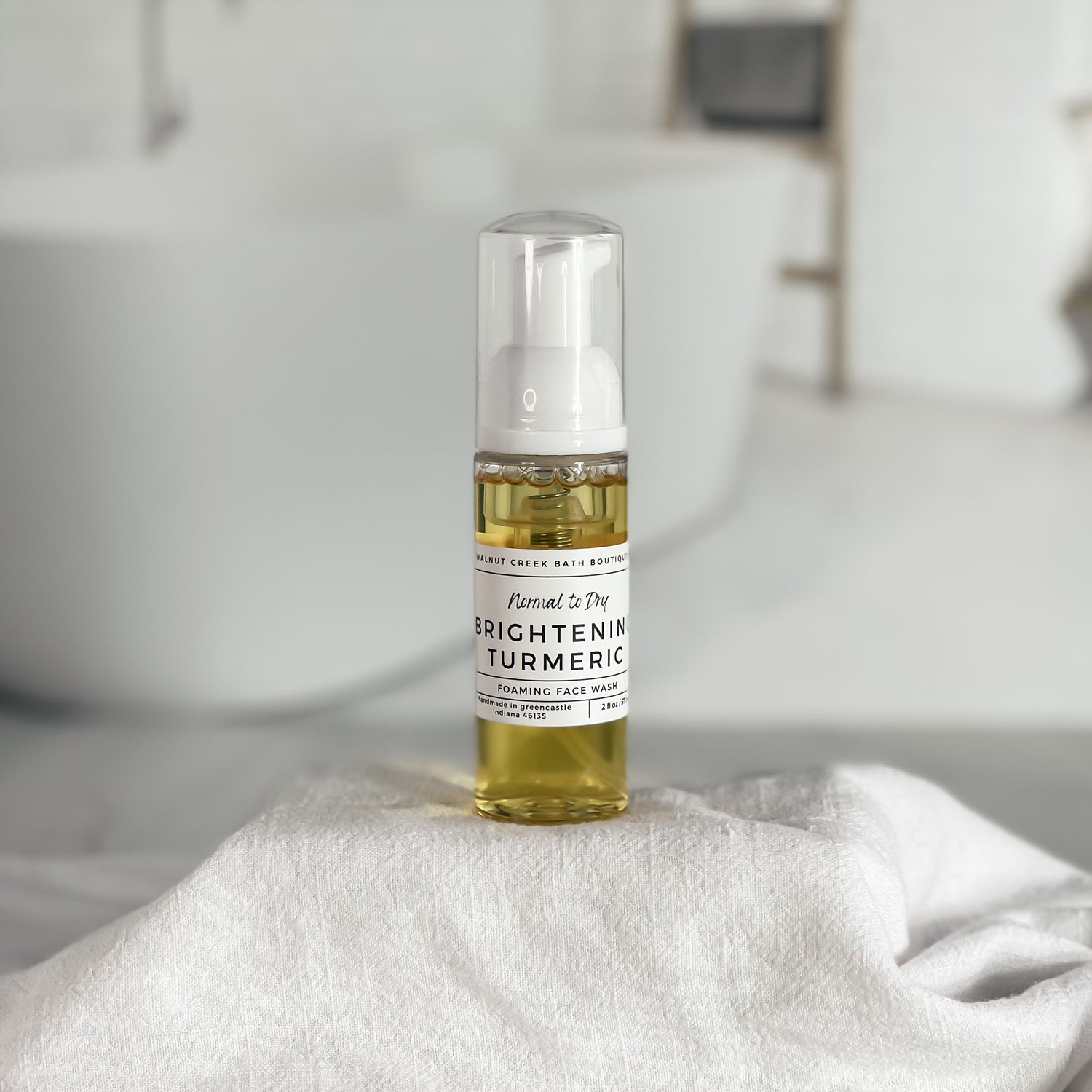 brightening face wash with turmeric is shown close up