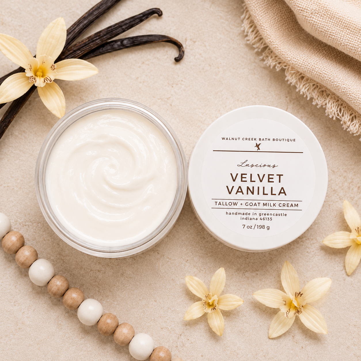 Jar of Velvet Vanilla cream with vanilla beans and flowers on a beige background