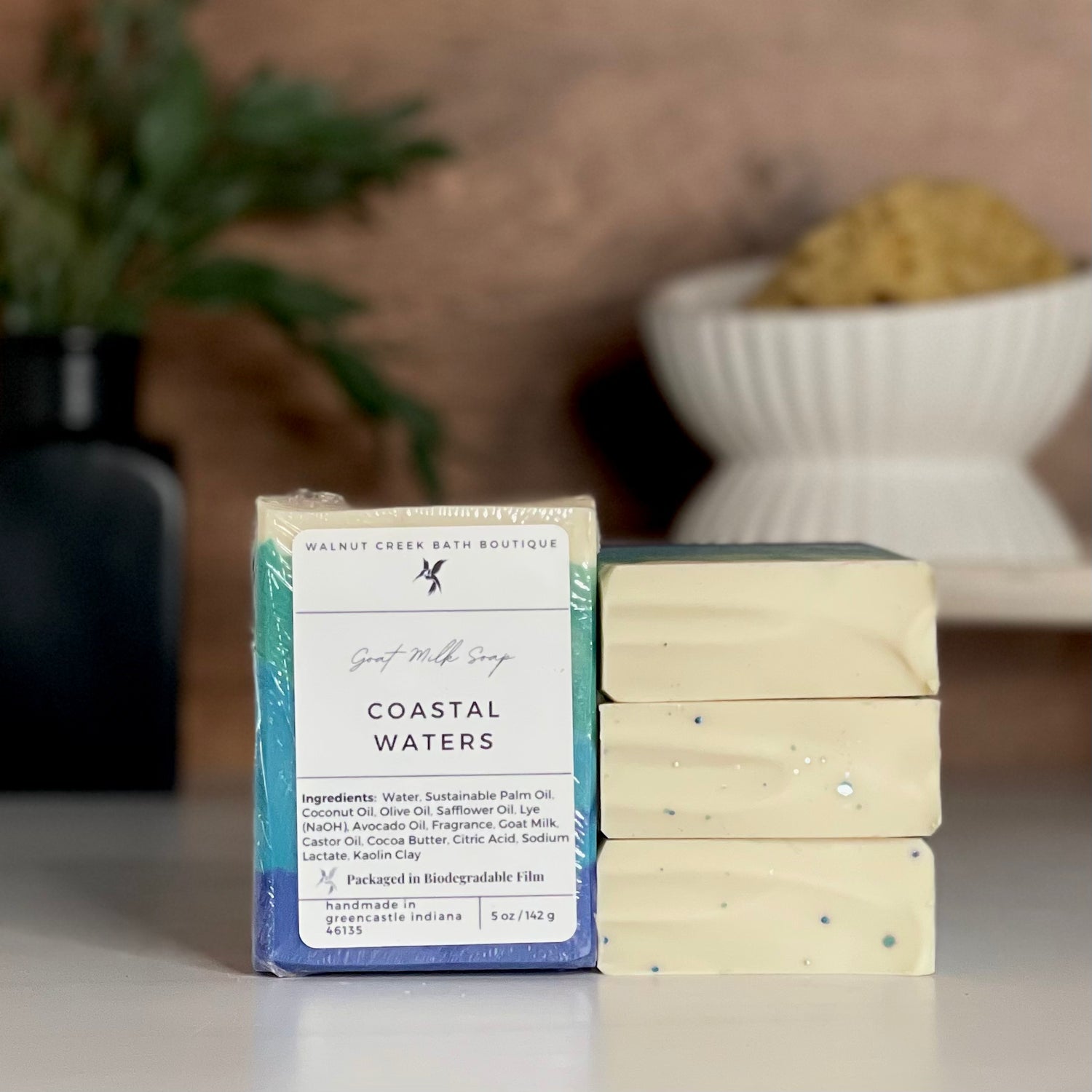 a coastal waters soap is standing tall packaged in it&