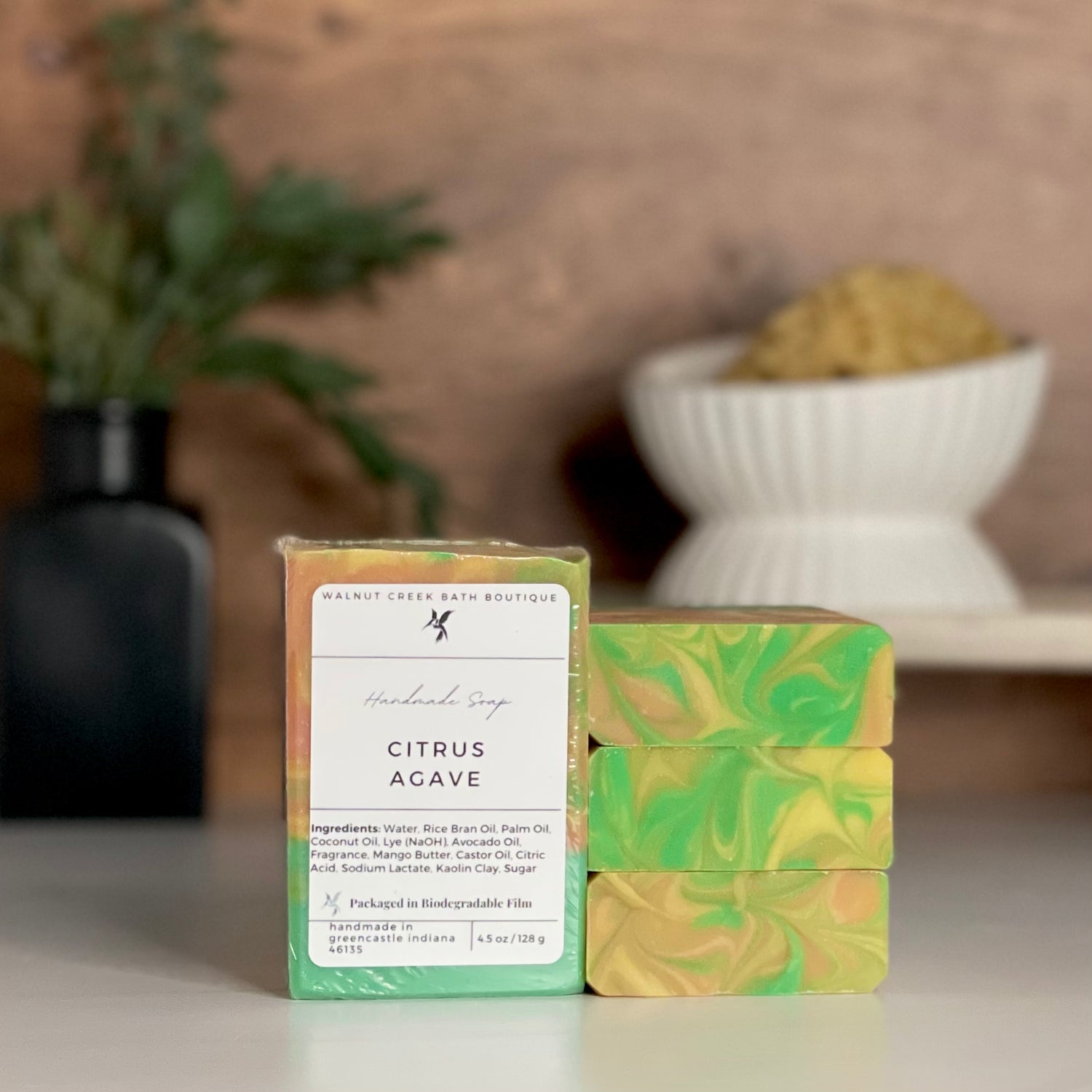 a citrus agave soap is standing tall packaged in it&