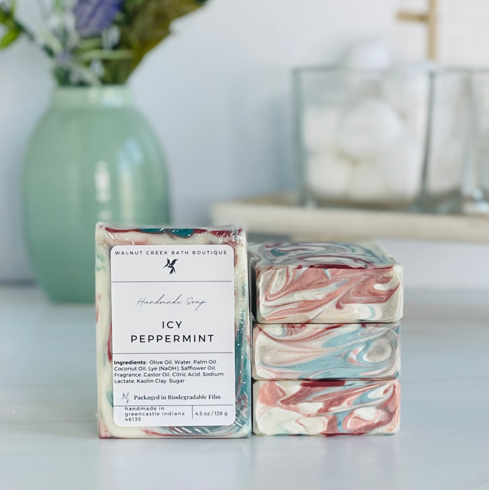 a icy peppermint soap is standing tall packaged in it&