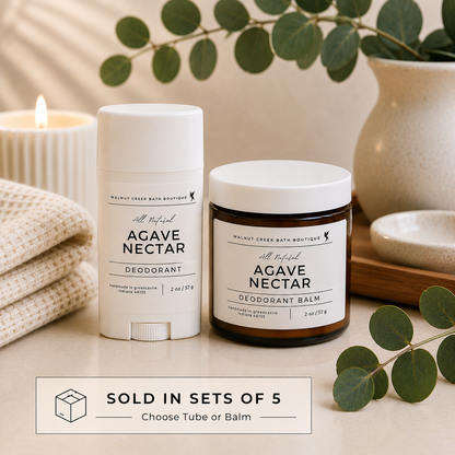 Agave Nectar deodorant and balm with a candle and plant in the background