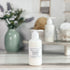 green oasis tallow lotion in a frosted white bottle with a white pump top
