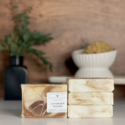 a lavender woods soap is standing tall packaged in it&