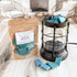 Ocean Breeze wax melts in packaging with a lantern on a wooden surface.