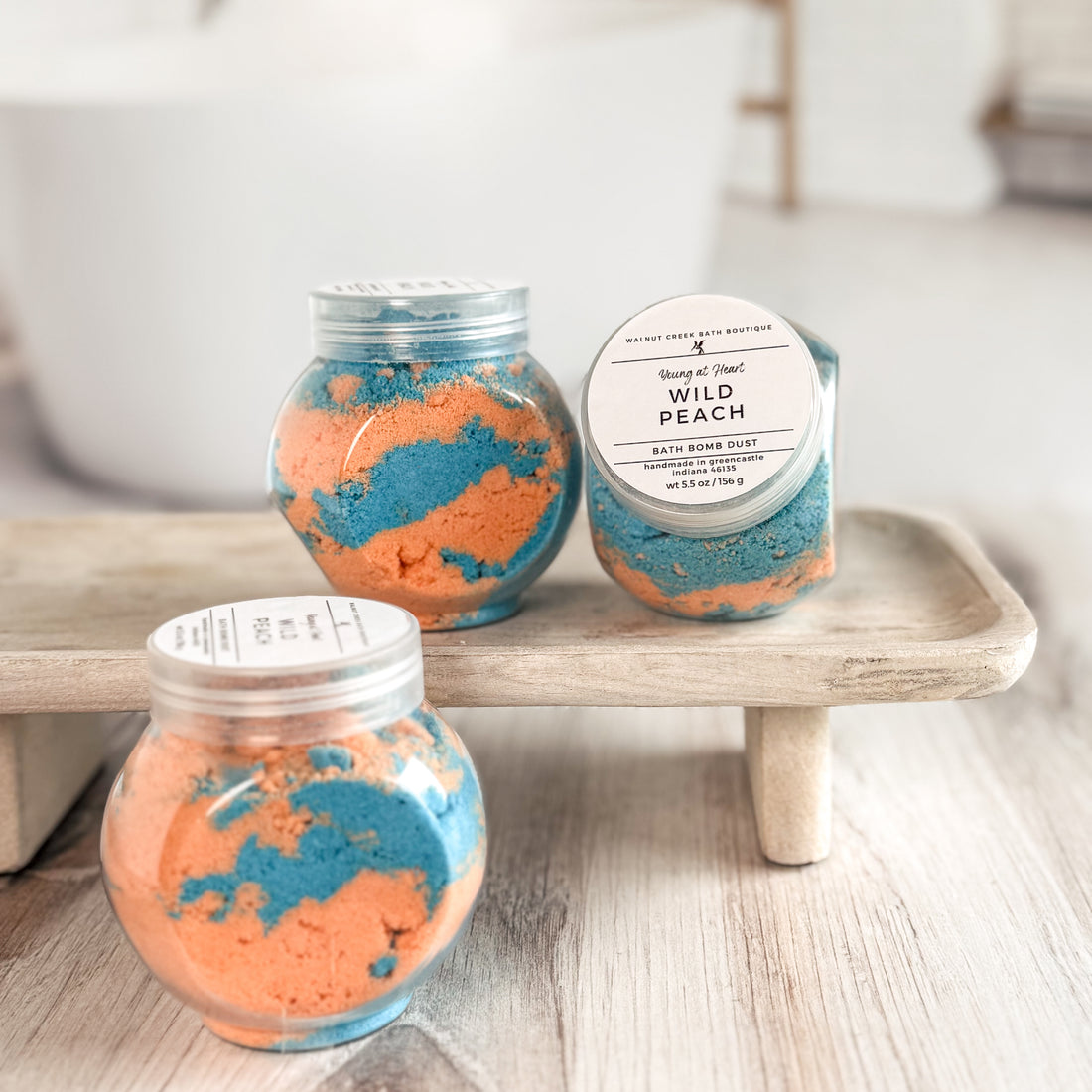 Two jars of bath bomb dust labeled &